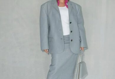 Amina Muaddi sets the bar high for sophisticated style at Prada’s menswear show in Milan