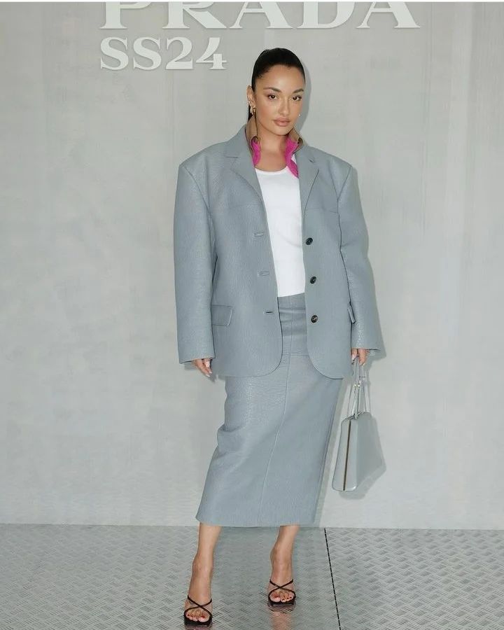 Amina Muaddi sets the bar high for sophisticated style at Prada’s menswear show in Milan