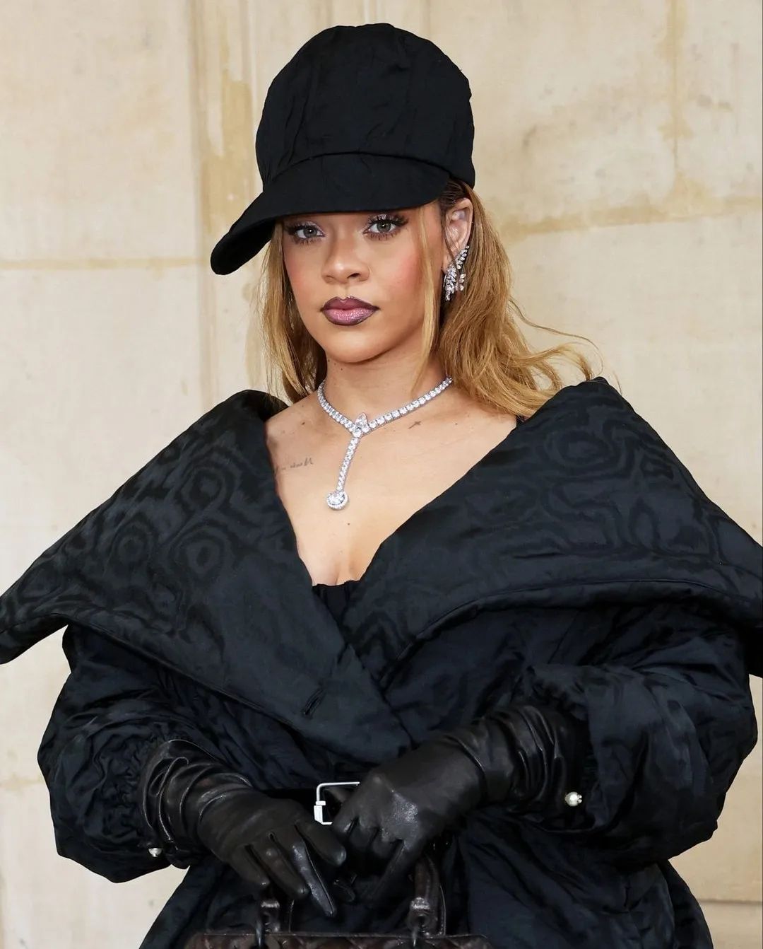 badgalriri at the Dior FW24 Couture Show and looking fabulous as always in dior and a touch of her own style added with a cap!