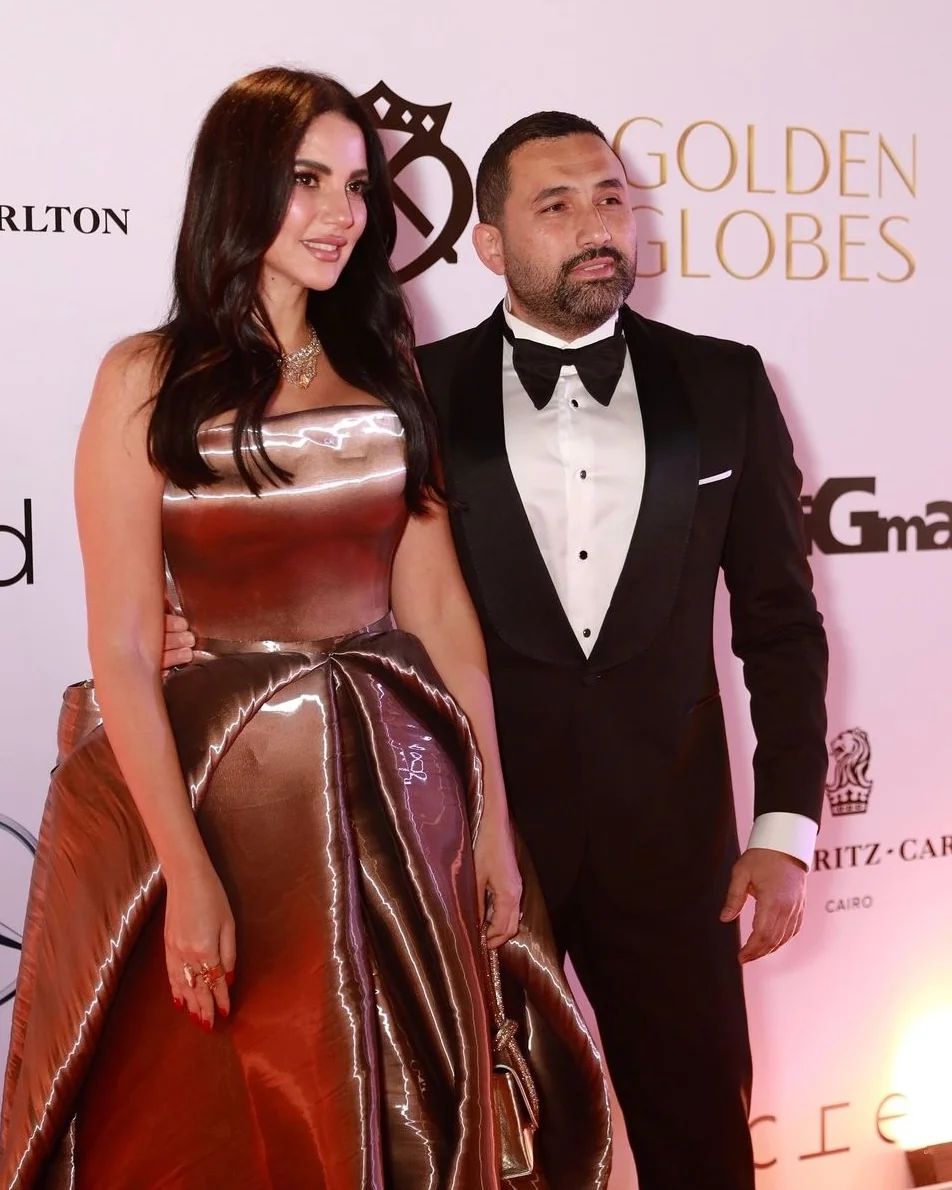 Dorra Zarrouk and Hany Saad turned heads in Cairo yesterday, radiating elegance and embodying true power couple vibes. Dorra dazzled in a timeless gown that highlighted her impeccable style, while Hany complemented her perfectly in a sharp, tailored suit that exuded sophistication. Their chemistry and effortless charm stole the spotlight, proving once again why they’re one of the most admired couples in the region. Whether on or off the red carpet, these two continue to set the bar for style and grace.