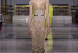 A couture masterpiece emerges, weaving the magnificence of savoir-faire. Each creation is a bold transformation, radiating grandeur from afar and captivating with figure-flattering silhouettes up close.