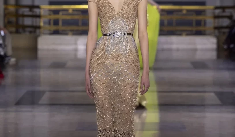 A couture masterpiece emerges, weaving the magnificence of savoir-faire. Each creation is a bold transformation, radiating grandeur from afar and captivating with figure-flattering silhouettes up close.