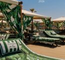 This summer, Dolce&Gabbana once again blurs the line between fashion, design, hospitality, and lifestyle with its latest DG Resort takeover at Twiga Versilia and Vesta. For Summer 2026, the Italian maison introduces the vibrant Banano motif, transforming one of Versilia’s most coveted seaside destinations into an immersive expression of la dolce vita. Inspired by lush tropical landscapes, graphic artistry, and the glamour of 1940s travel posters, the fresh print envelops the beach club in a sophisticated palette that feels both nostalgic and distinctly contemporary.
